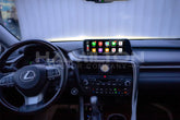 Car dashboard with a touchscreen display and Lexus logo.