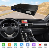 Car dashboard with a multimedia receiver and touchscreen display, road visible through the windshield.