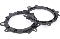 Two black metal gaskets on a white background