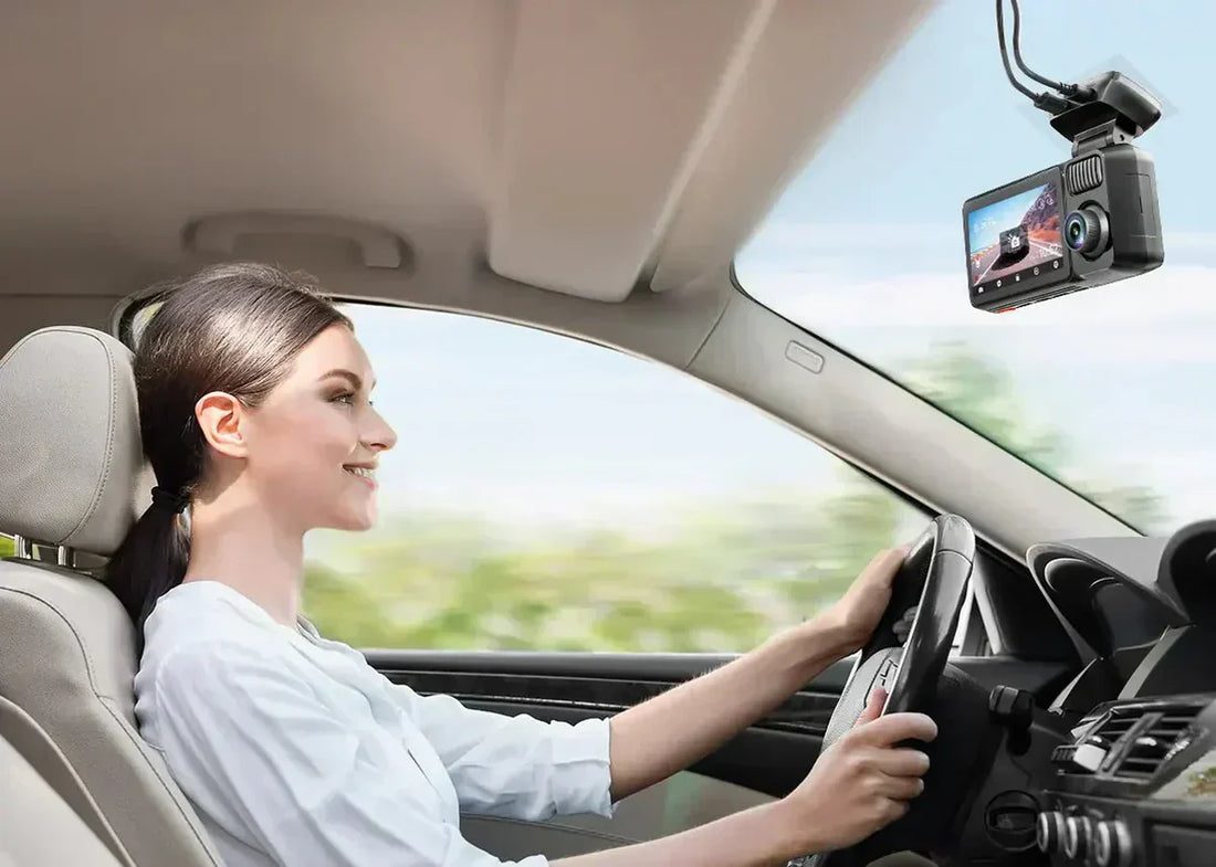 Image of a lady driving with a dash cam in her car.