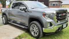 The image showcases a 22-inch Hardrock H503 Spine Xposed on a GMC truck.