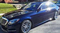 Blue Mercedes-Benz car parked on a street with 22' Laxani Wheels