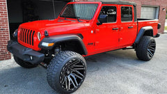 Custom Wheels: 22” TIS 554BM Gloss Black Milled Rims