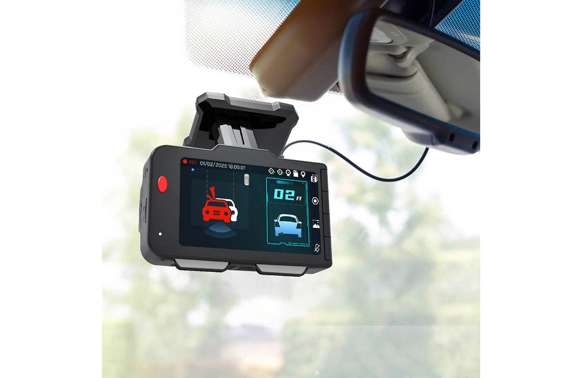 Car dashboard with a radar detector device displaying readings.