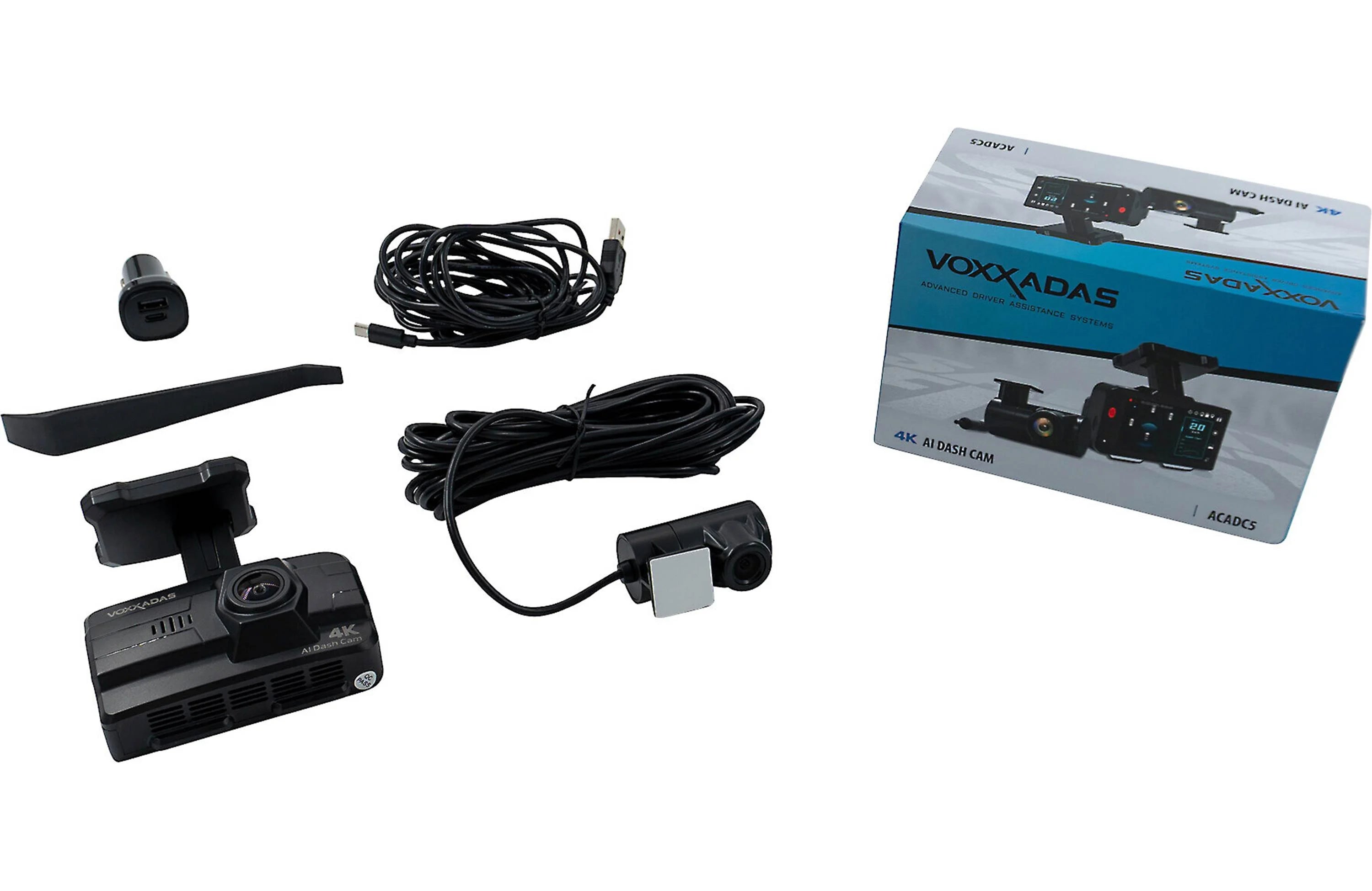 Car dashboard camera system with cables and packaging on a white background