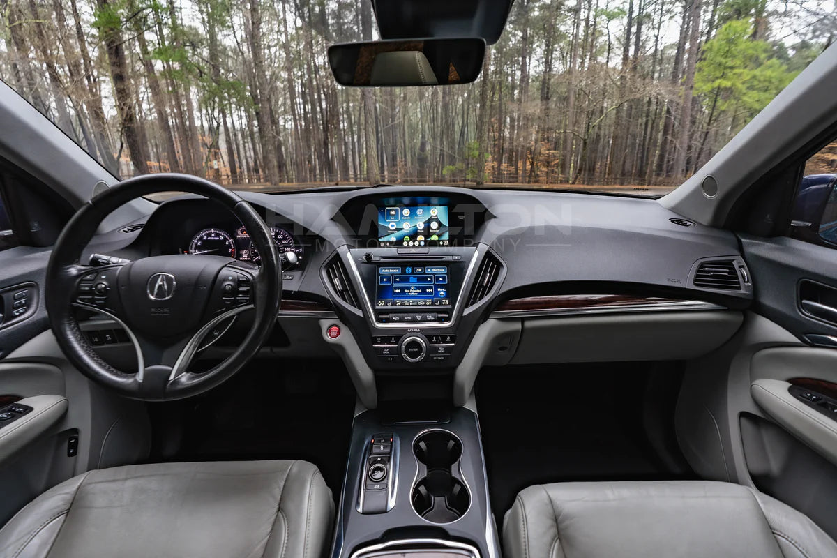 Car interior with dashboard and steering wheel in a forest setting