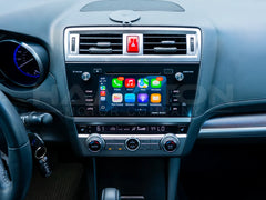 Car dashboard with digital display showing app icons