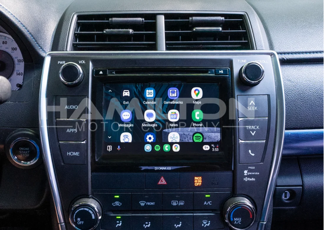 Car dashboard with a touchscreen display and control buttons