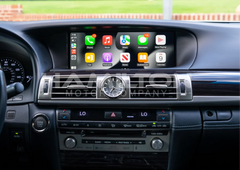 Car dashboard with a touchscreen display showing app icons, branded 'HAIERS MOTOR COMPANY'.