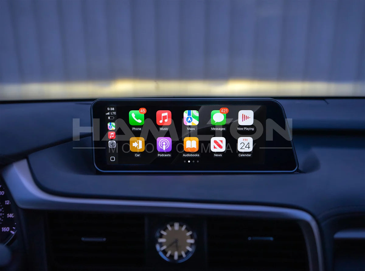 Car dashboard with a digital display showing app icons.