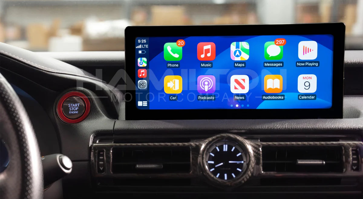 Car dashboard with a touchscreen display showing app icons.