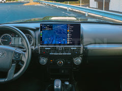 Car interior with a focus on the dashboard and navigation screen.