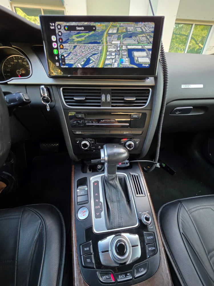 Car interior with a GPS navigation system displayed on the dashboard.
