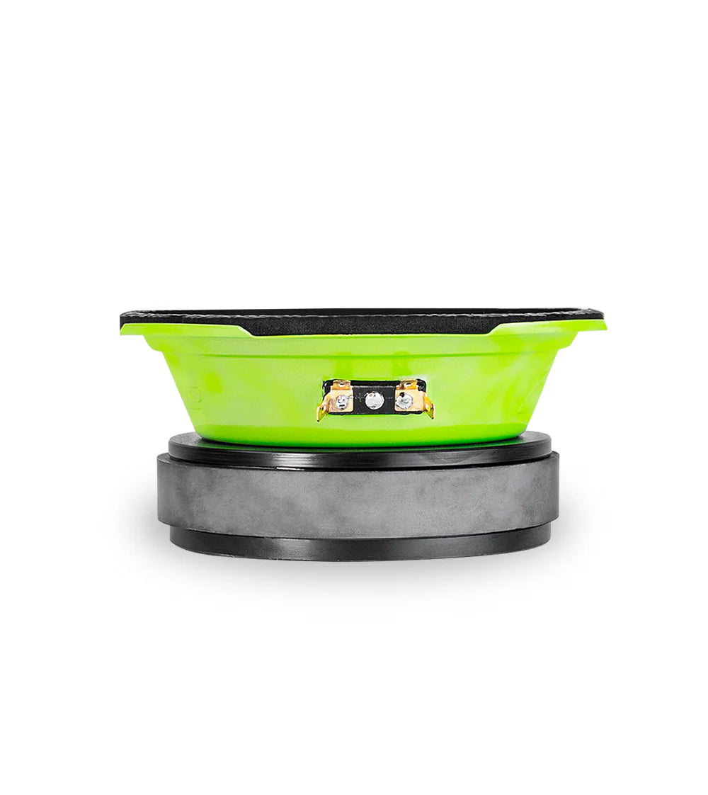 Green and black car speaker on a white background