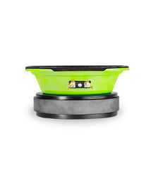 Green and black car speaker on a white background