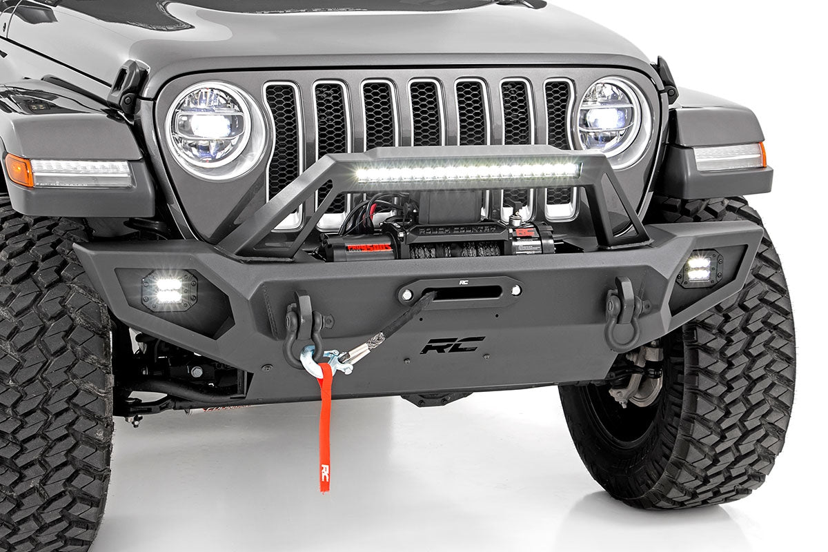 Front view of a Jeep with a bumper and LED light bar on a white background