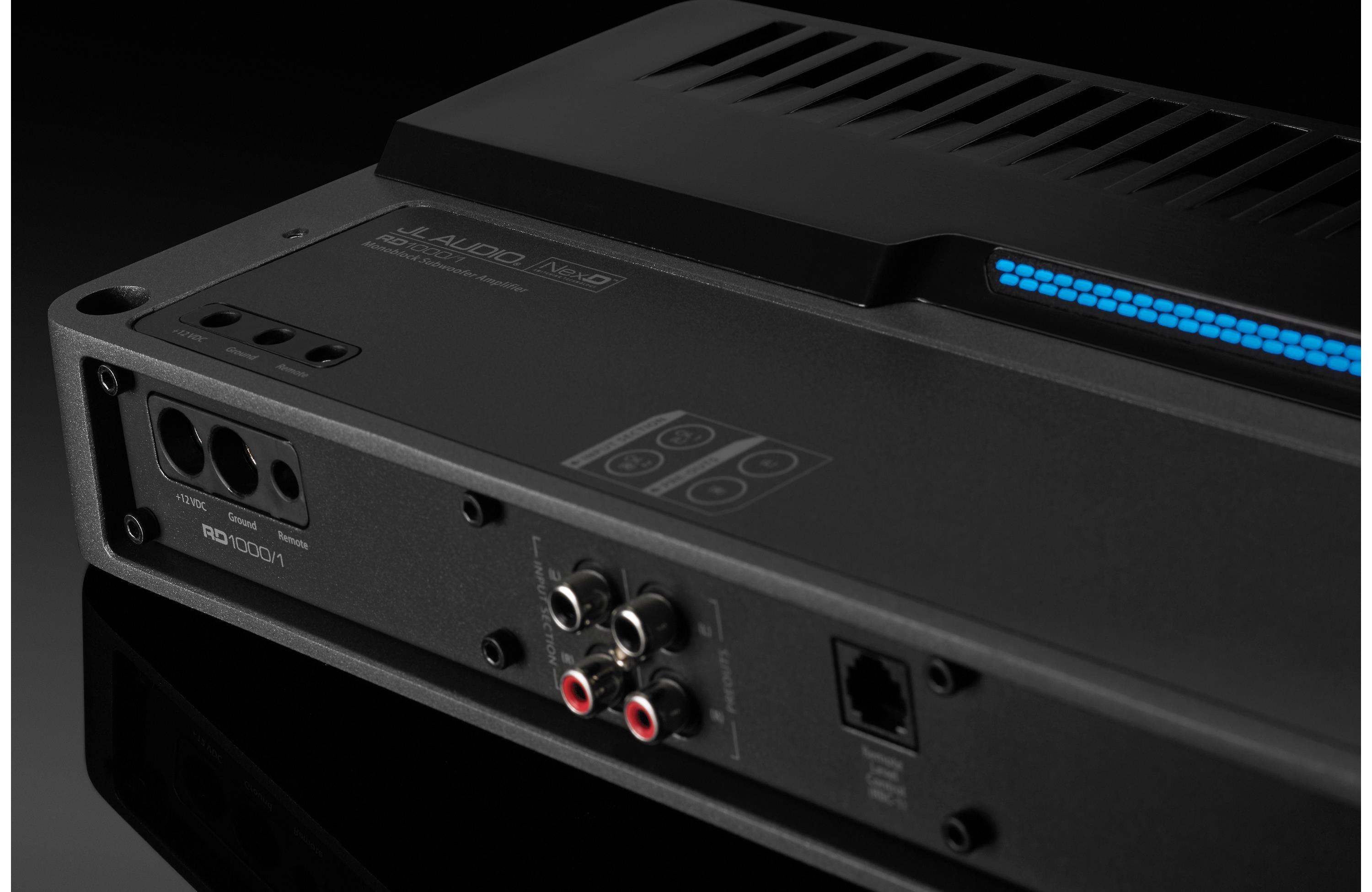 Back view of a black electronic device with various ports on a dark background