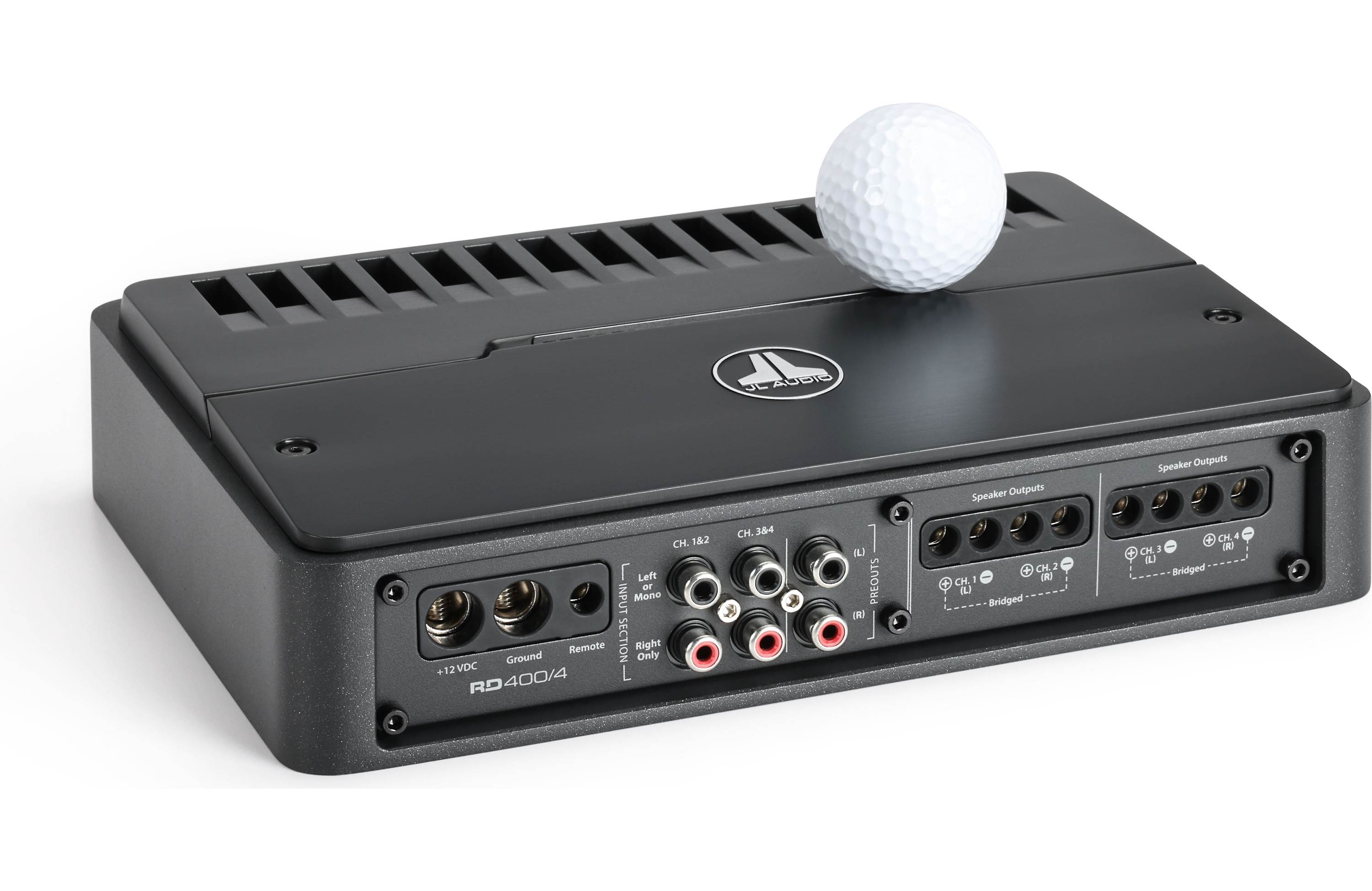 Black audio amplifier with a golf ball on top