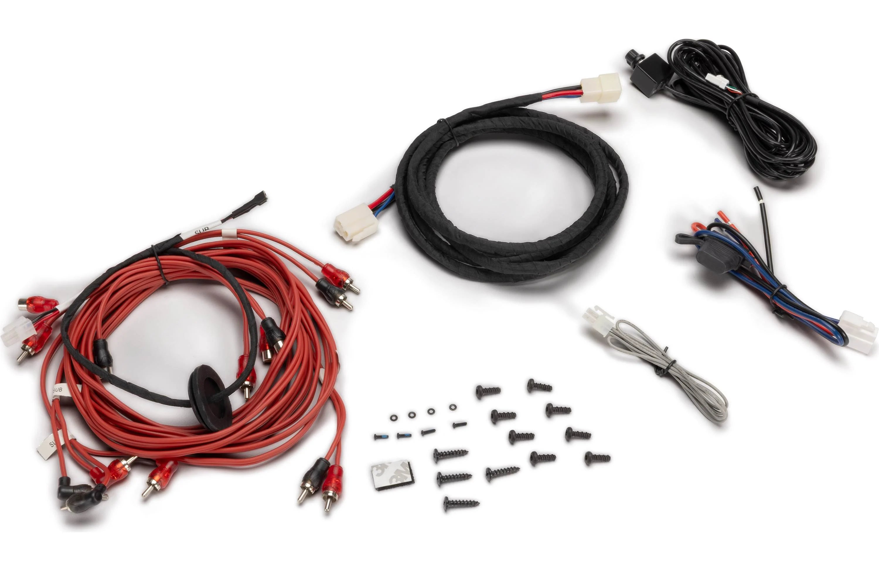 Automotive wiring harness kit with various components on a white background