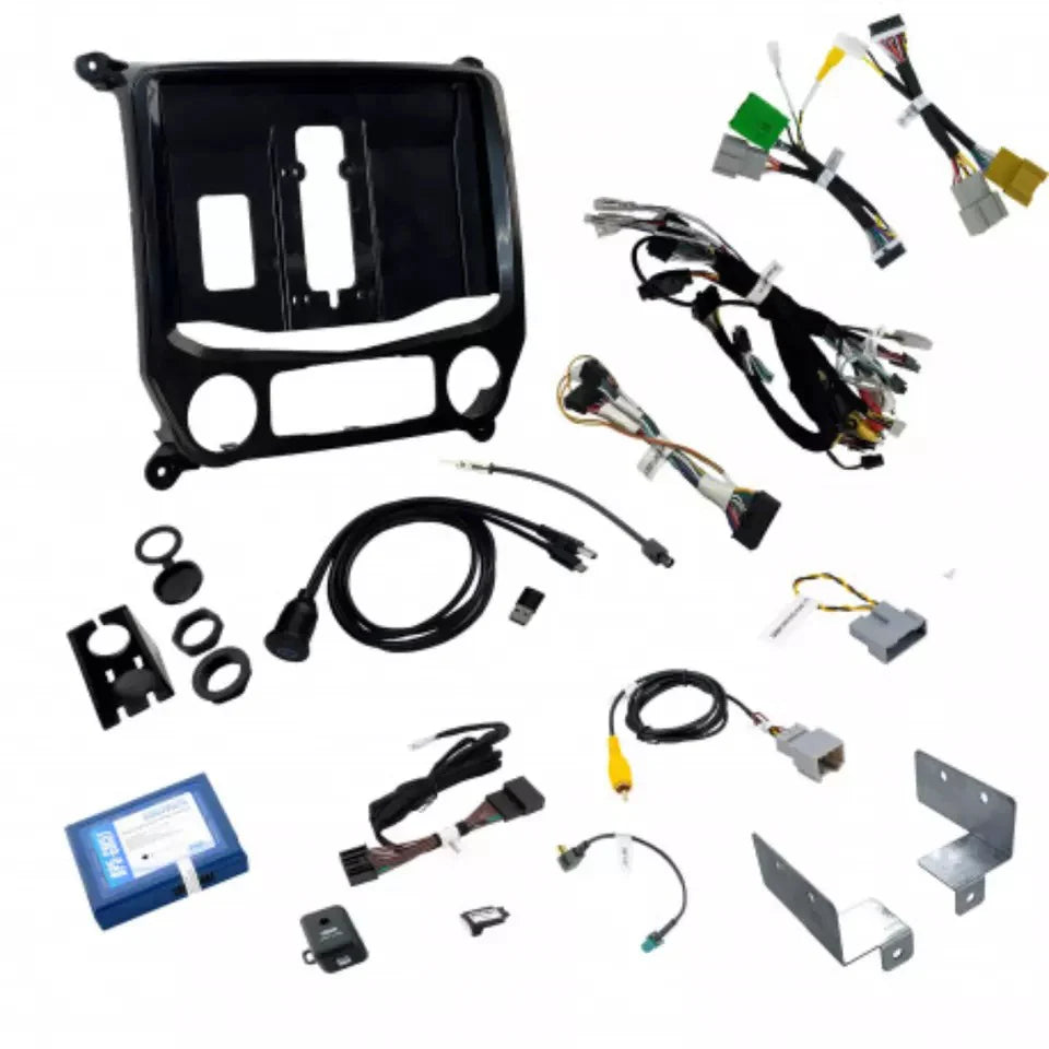 Collection of car audio and wiring components on a white background
