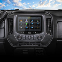 Car dashboard with infotainment system displaying a smartphone interface against a blue sky.