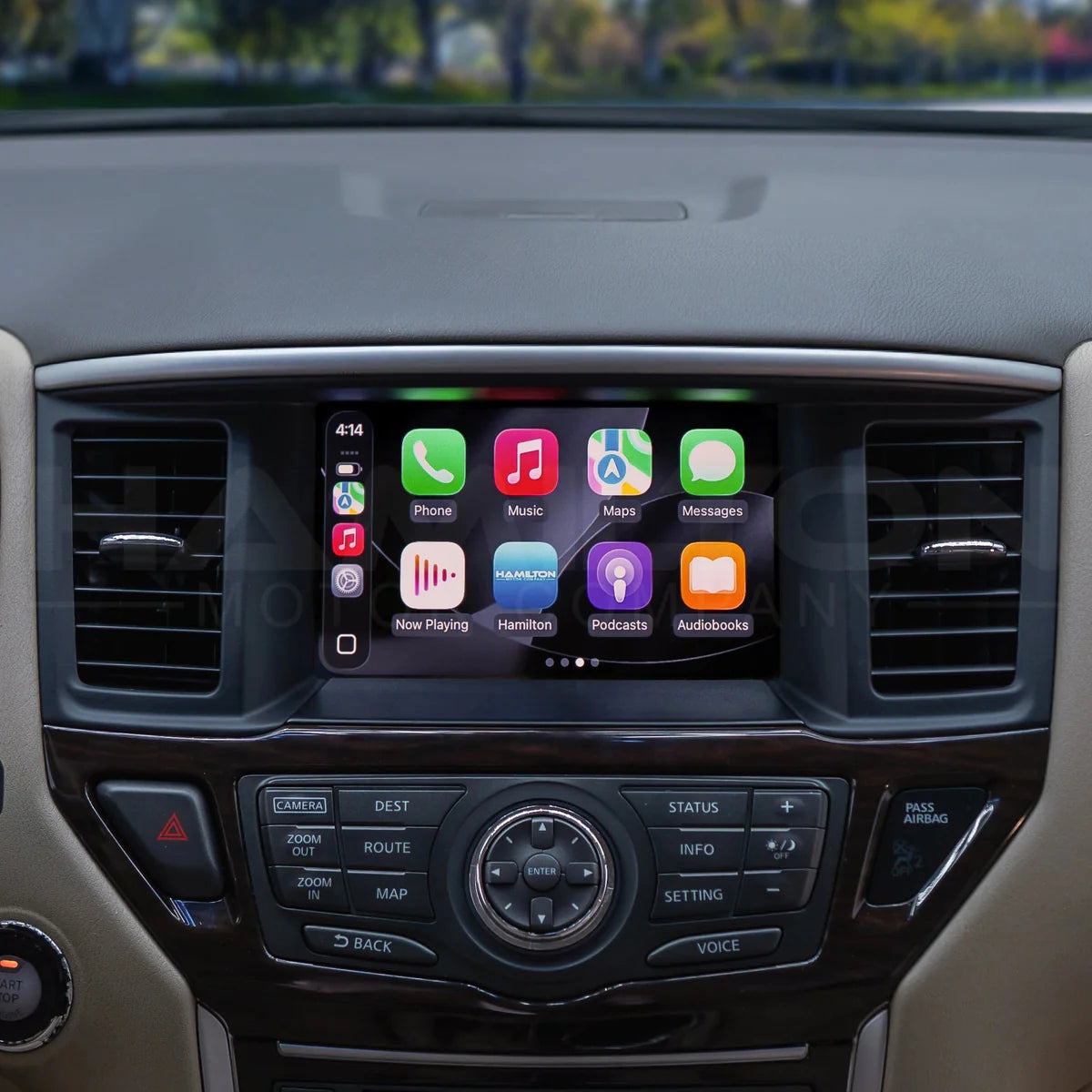 Car dashboard with a touchscreen display showing app icons.