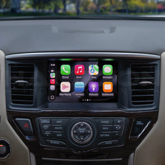 Car dashboard with a touchscreen display showing app icons.