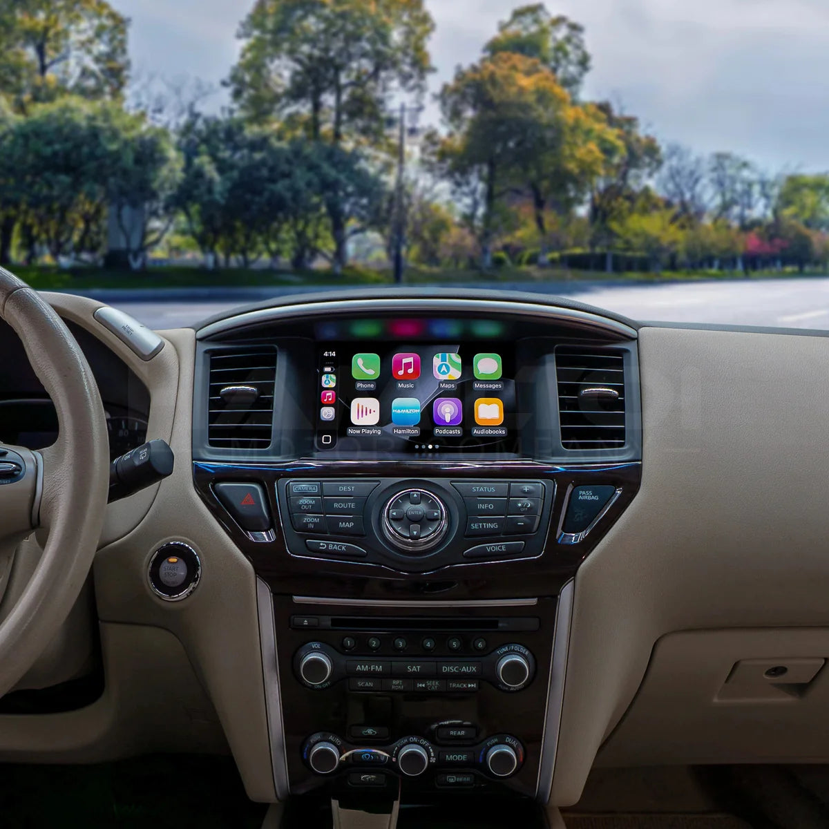 Car interior with a focus on the dashboard and infotainment system, showing a clear view of the road ahead.