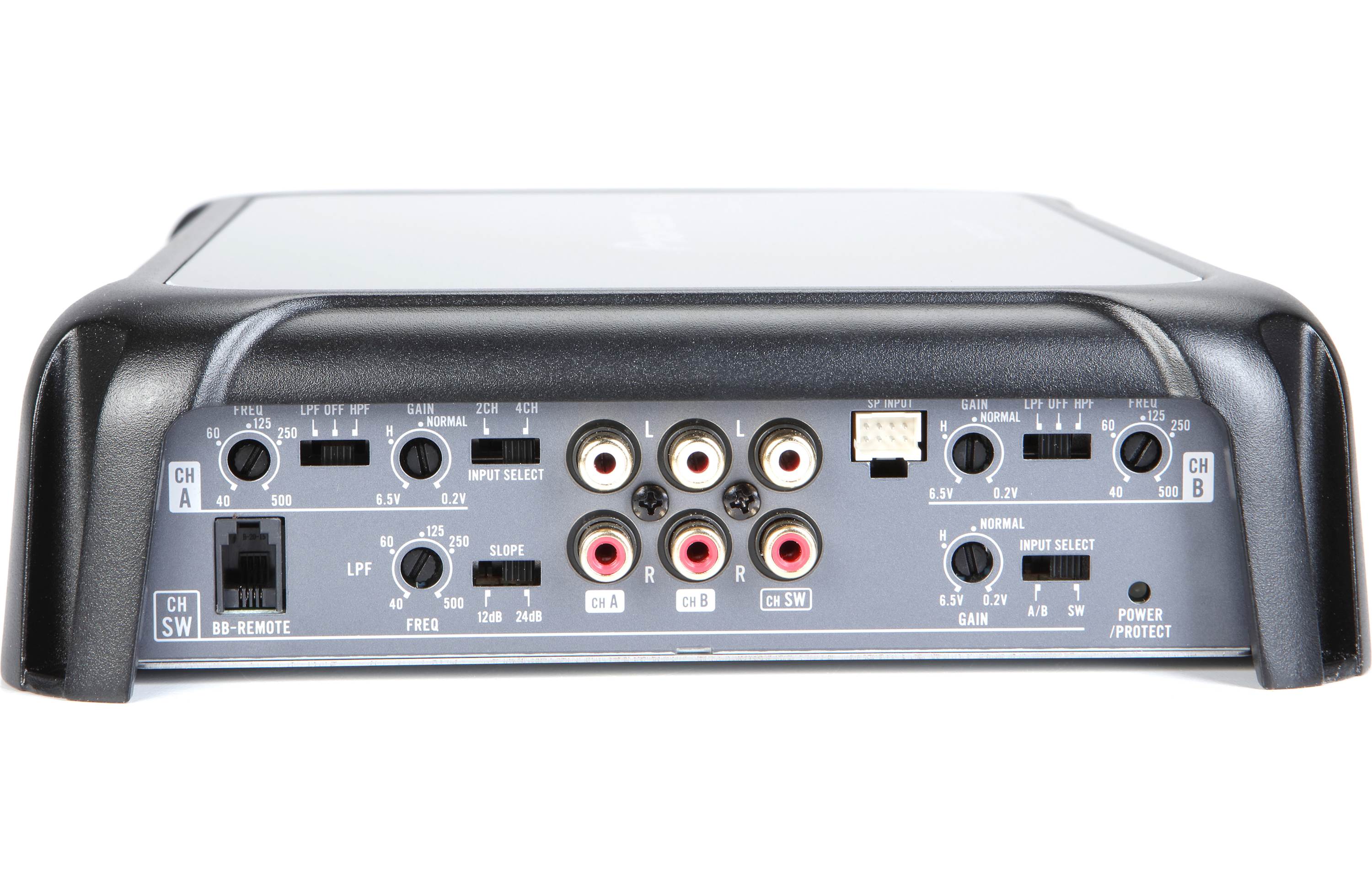Back panel of an audio amplifier with various connectors on a white background