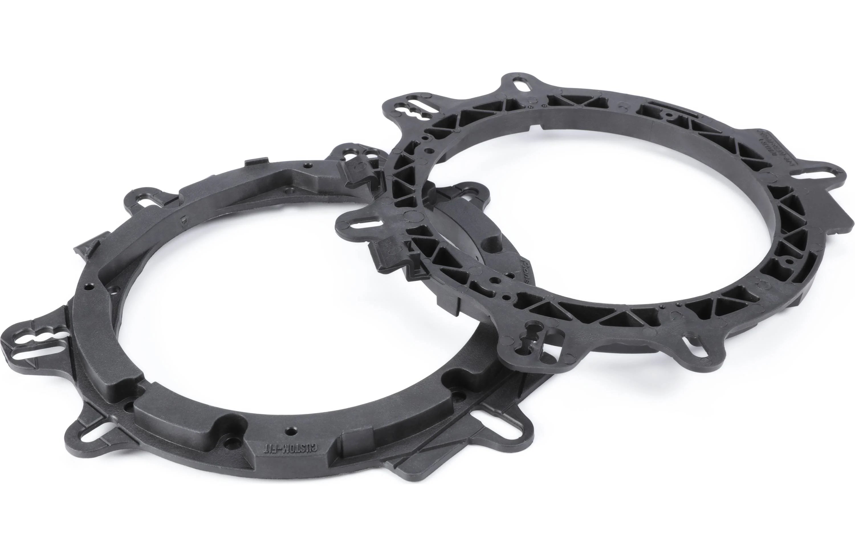 Two black metal gaskets on a white background