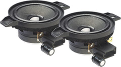 Two black speaker cones with metal frames on a white background