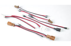 Set of electronic connectors with red and black wires on a white background