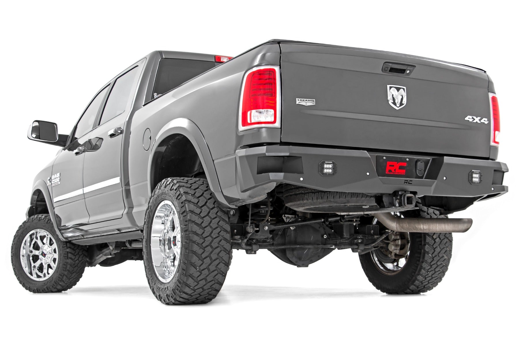 Gray pickup truck with off-road tires on a white background