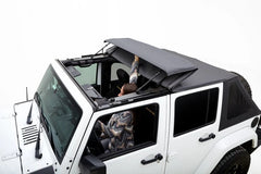 White Jeep Wrangler with a black soft top on a white background