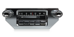 Vintage car radio with chrome accents on a white background