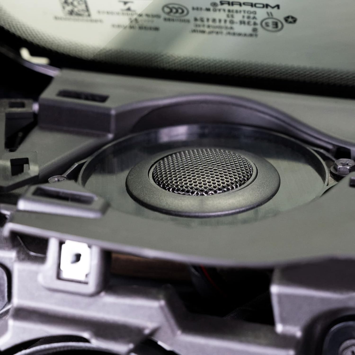 Close-up of a mechanical component with a brand label in the background