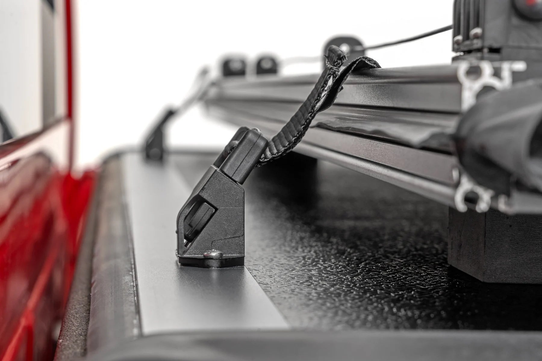 Close-up of a vehicle roof rack system on a truck bed.