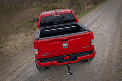 Red pickup truck on a dirt road