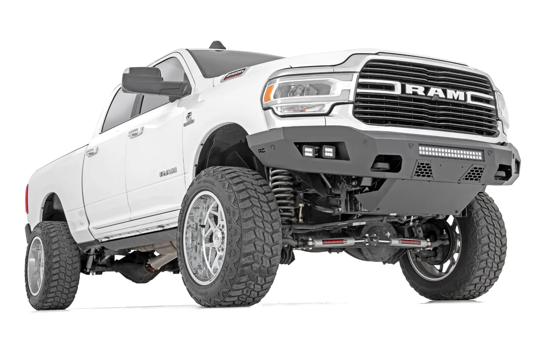 White Ram truck with off-road modifications on a white background