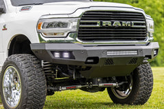 White Ram truck with off-road modifications on a grassy background