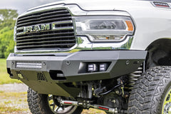 Close-up of a Ram truck's front grille and bumper with visible branding.