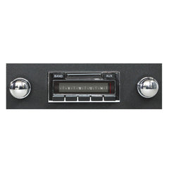 Vintage-style car radio with chrome knobs on a white background