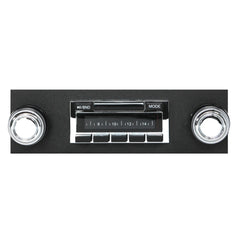 Vintage-style car radio with chrome knobs on a white background