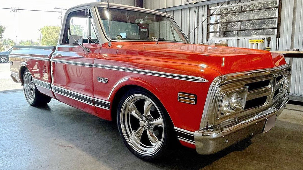 Red vintage truck parked inside a building