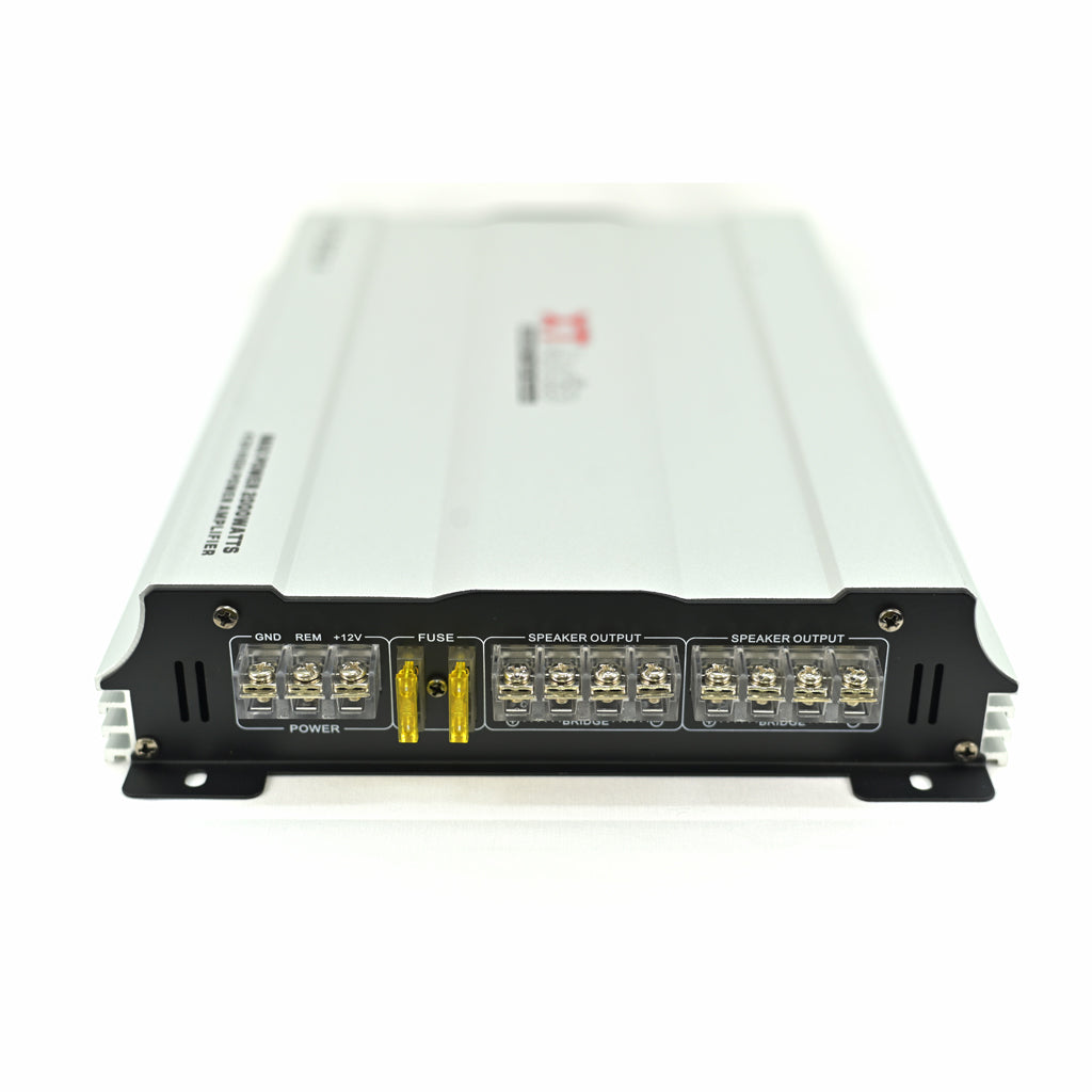 Car audio amplifier with multiple connectors on a white background